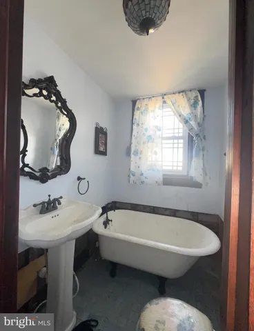 a living room with furniture a window and a piano table