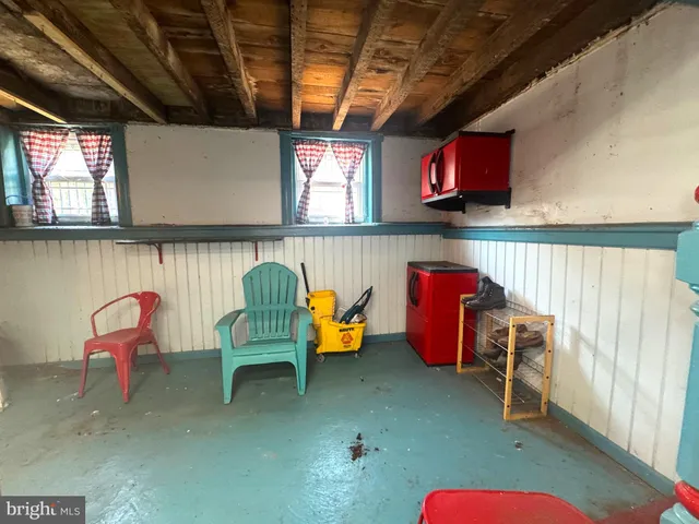 a view of a backyard with trees and plants