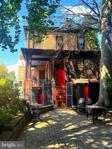 a street sign on a pole on a street