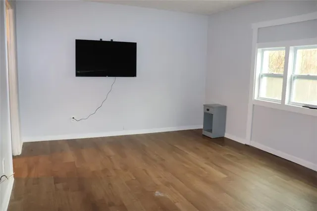 a front view of a house with a potted plant