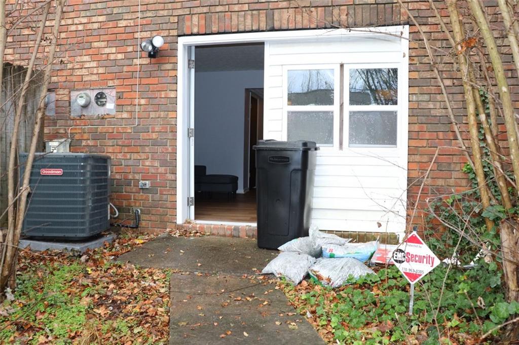 2572 Stratford Lane Morrow, GA 30260 - Photo 12 of 17 a front view of a house with a potted plant