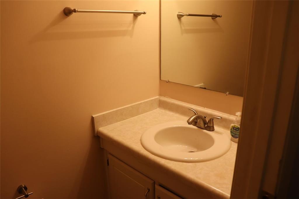 2572 Stratford Lane Morrow, GA 30260 - Photo 13 of 17 a bathroom with a sink and a mirror