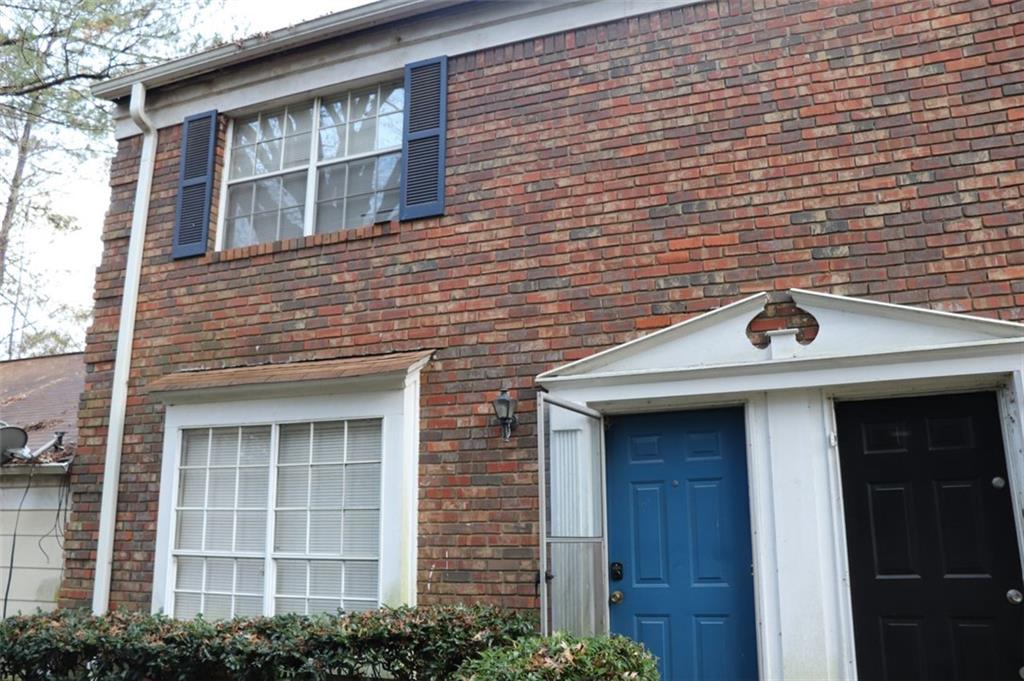 2572 Stratford Lane Morrow, GA 30260 - Photo 17 of 17 a front view of a building with a garden