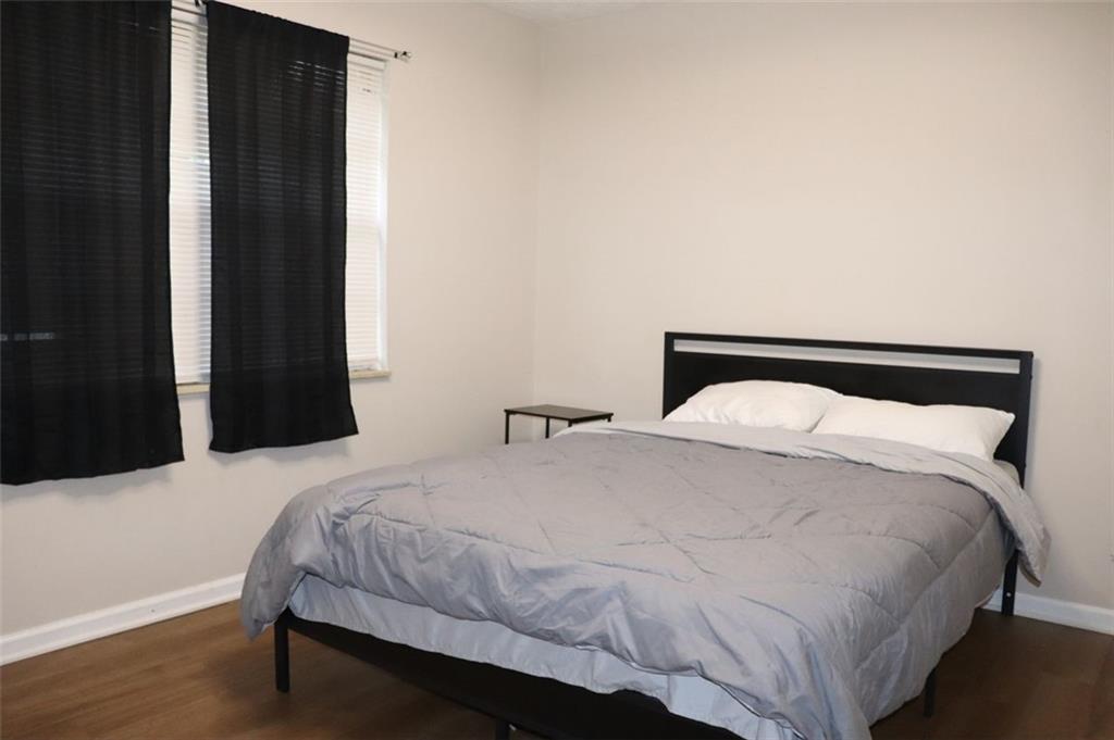 2572 Stratford Lane Morrow, GA 30260 - Photo 2 of 17 a bedroom with a bed and a night stand