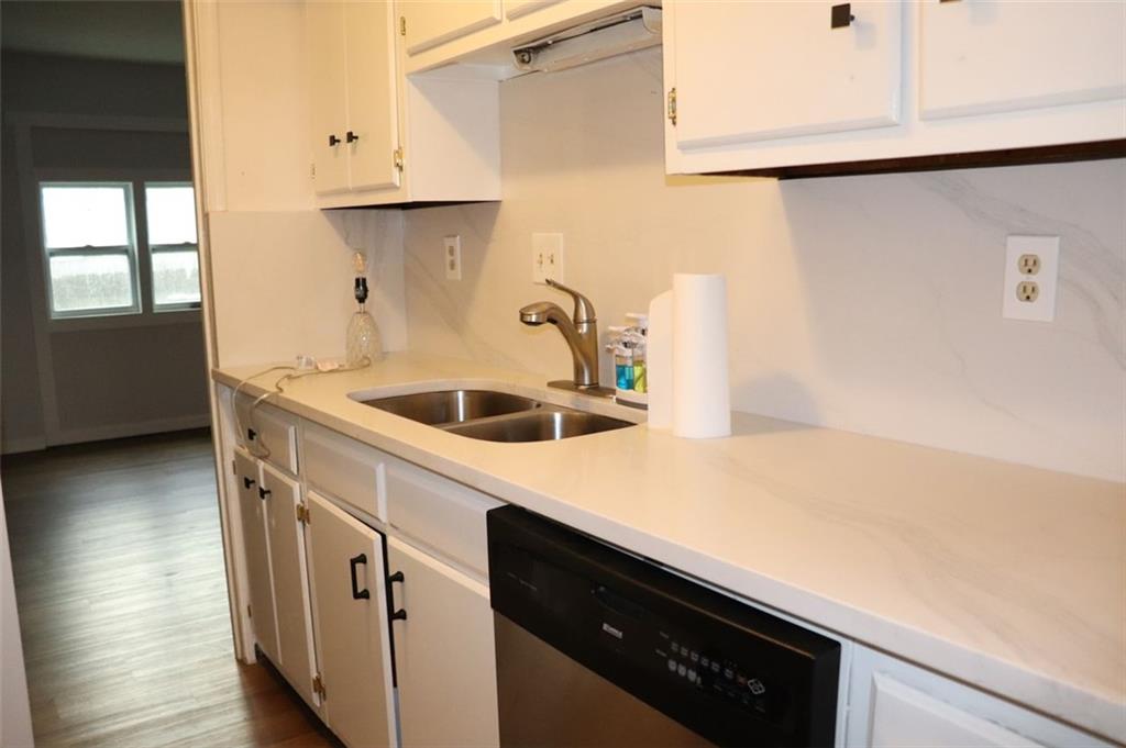 2572 Stratford Lane Morrow, GA 30260 - Photo 8 of 17 a kitchen with a sink a stove and cabinets