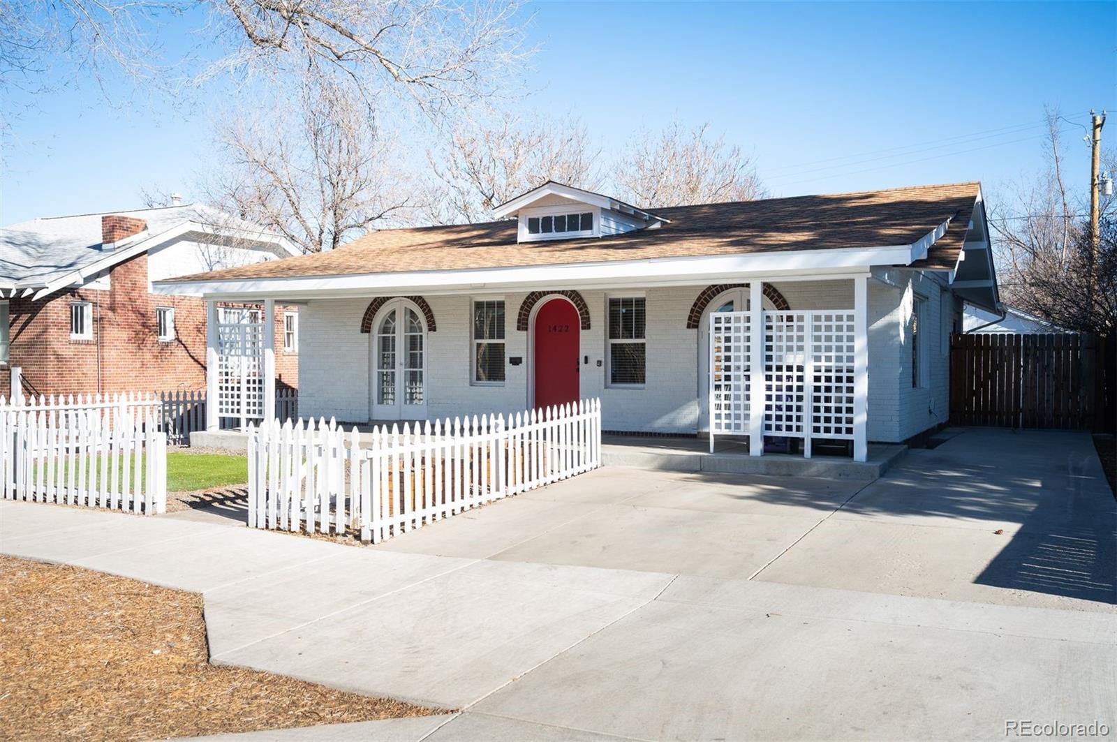 1422 Quebec Street Denver, CO 80220 - Photo 1 of 19 a front view of a house with a garage