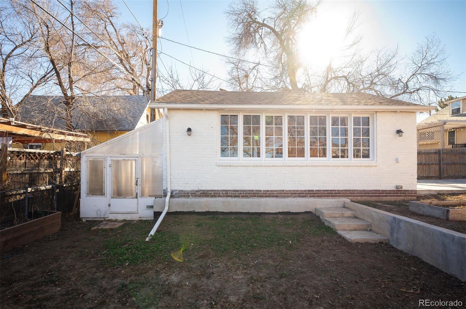 1422 Quebec Street Denver, CO 80220 - Photo 14 of 19 a house view with a backyard space