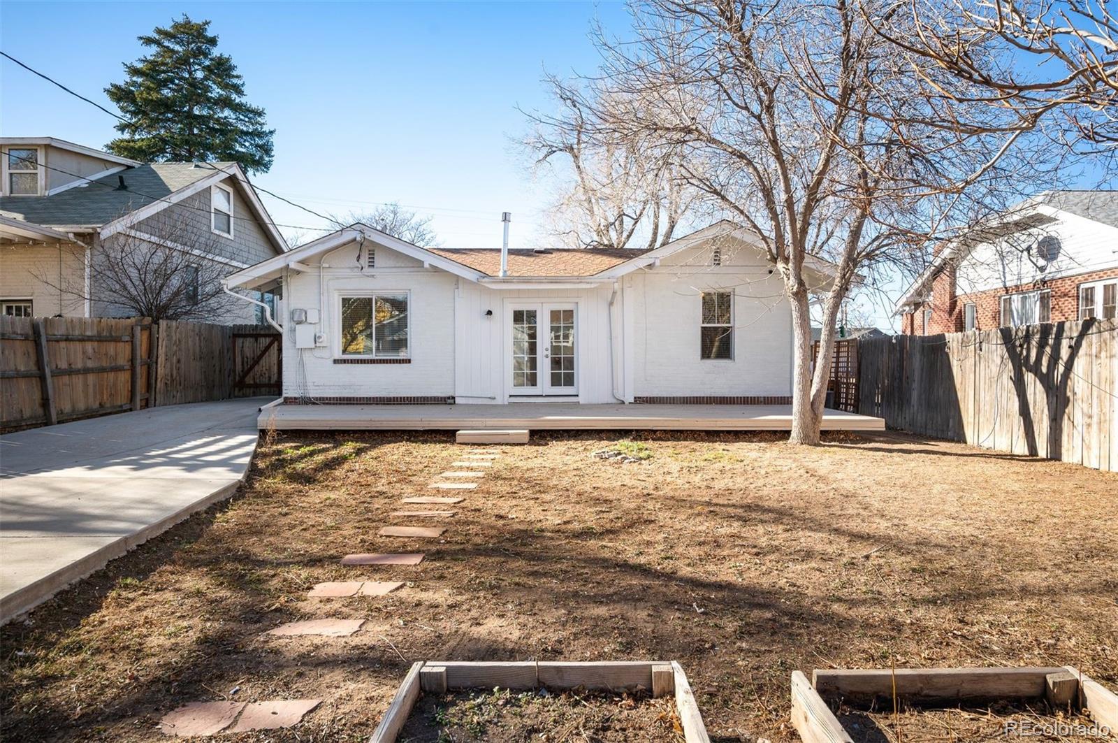 1422 Quebec Street Denver, CO 80220 - Photo 15 of 19 a front view of house with yard