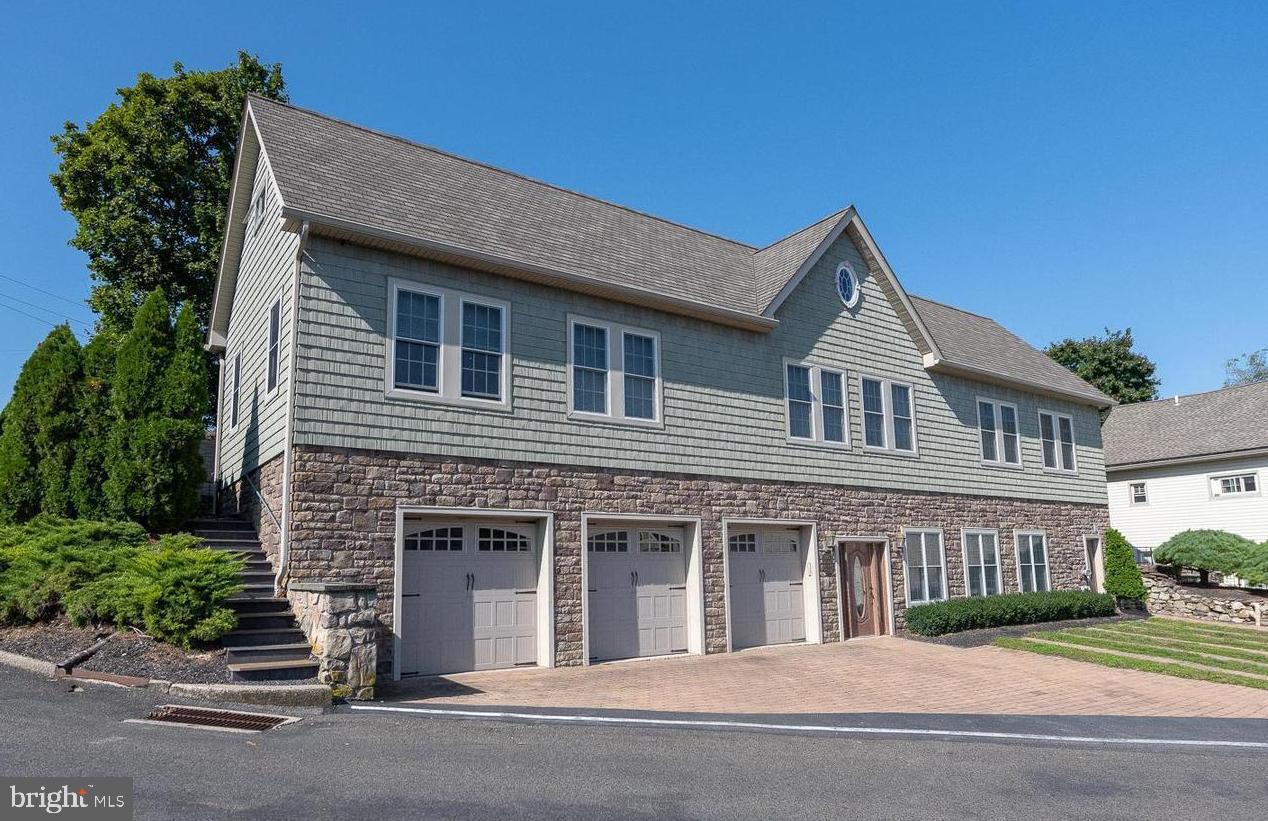 683 Easton Road, Unit B Riegelsville, PA 18077 - Photo 2 of 9 a front view of a house with a garden