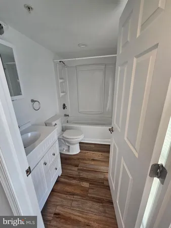a bathroom with a sink a toilet and a bathtub