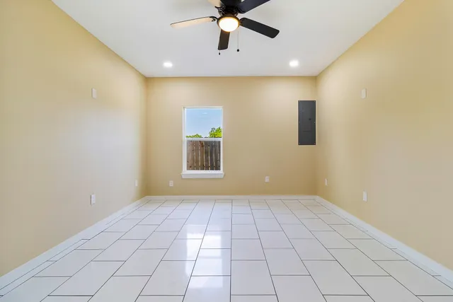 a view of an empty room with a window