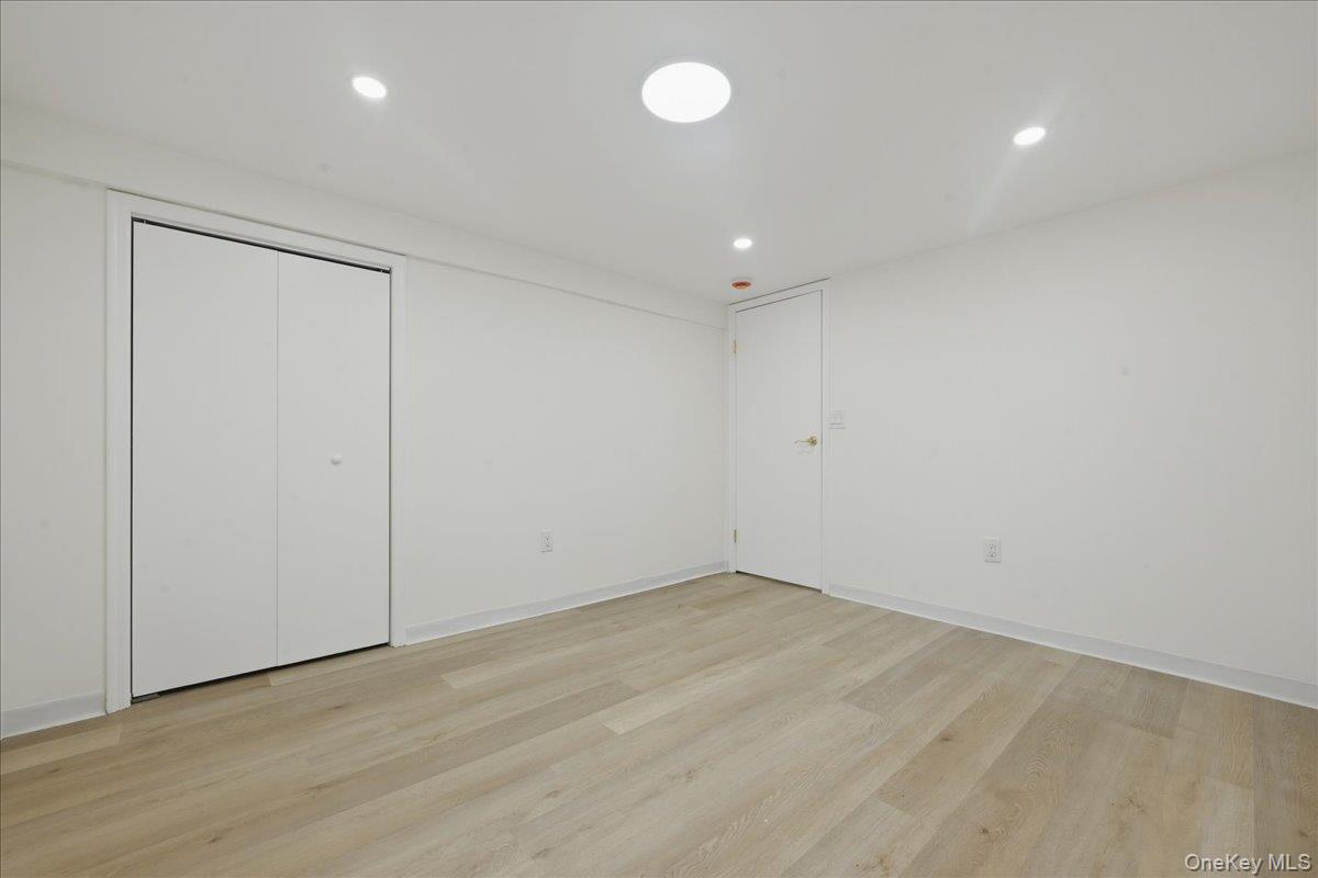 84 North Fordham Road Hicksville, NY 11801 - Photo 22 of 28 wooden floor in an empty room