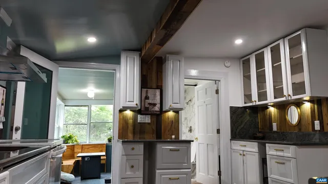 a view of a dining room with furniture and window