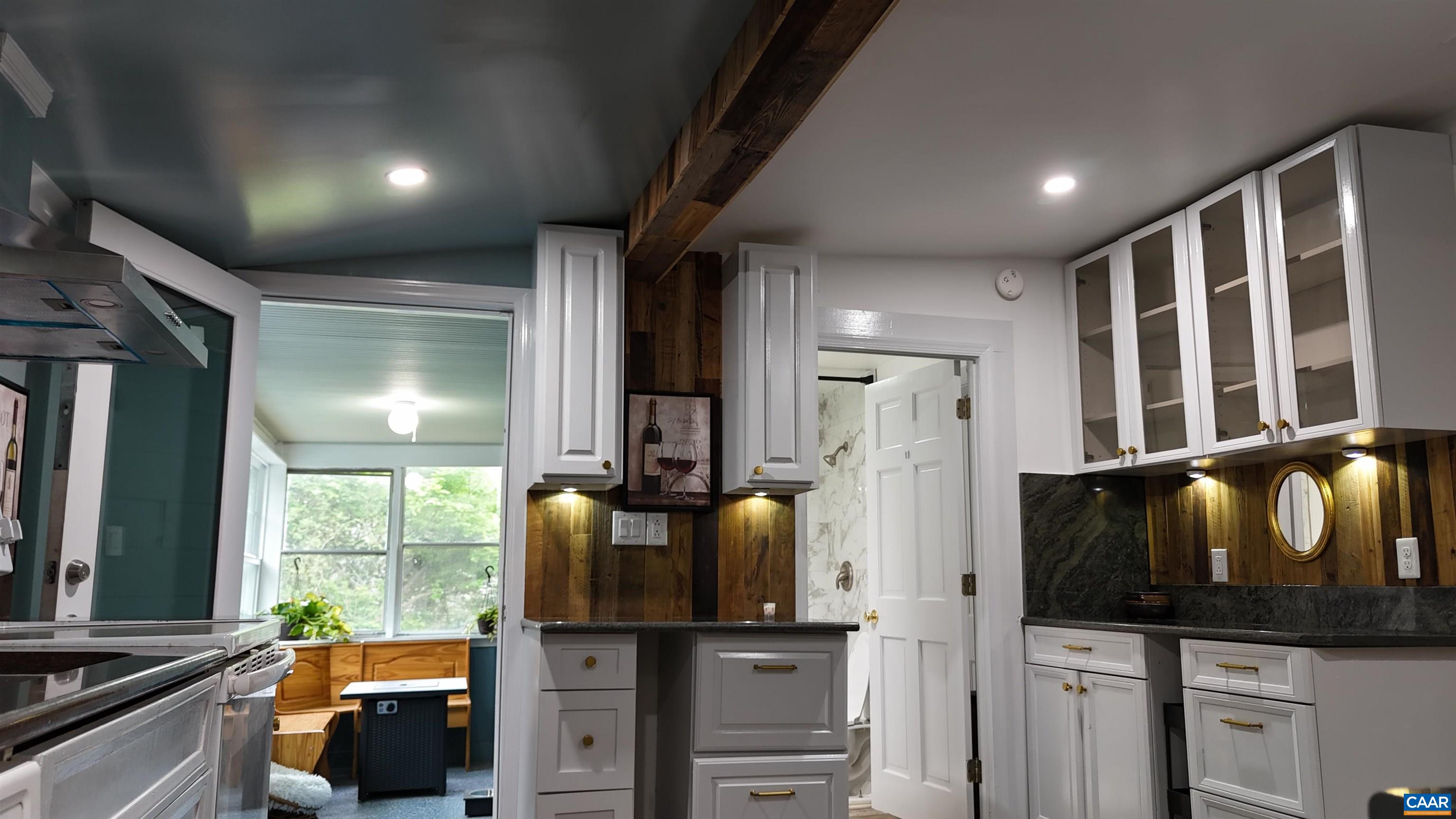 7559 Esmont Road Esmont, VA 22937 - Photo 11 of 22 a kitchen with stainless steel appliances kitchen island granite countertop a refrigerator stove and sink
