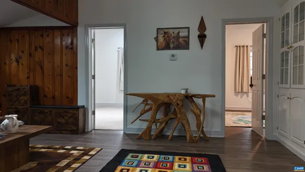 a room with furniture and wooden floor