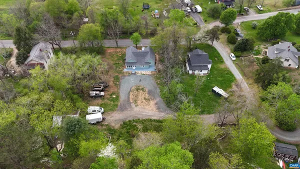 an aerial view of a house with outdoor space and street view