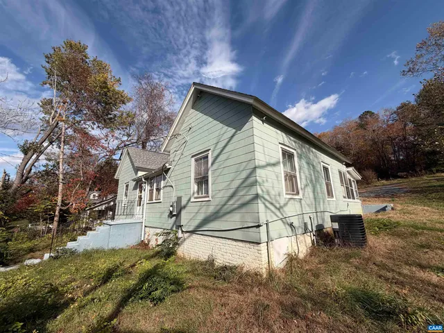 a kitchen with stainless steel appliances kitchen island granite countertop a refrigerator stove and sink
