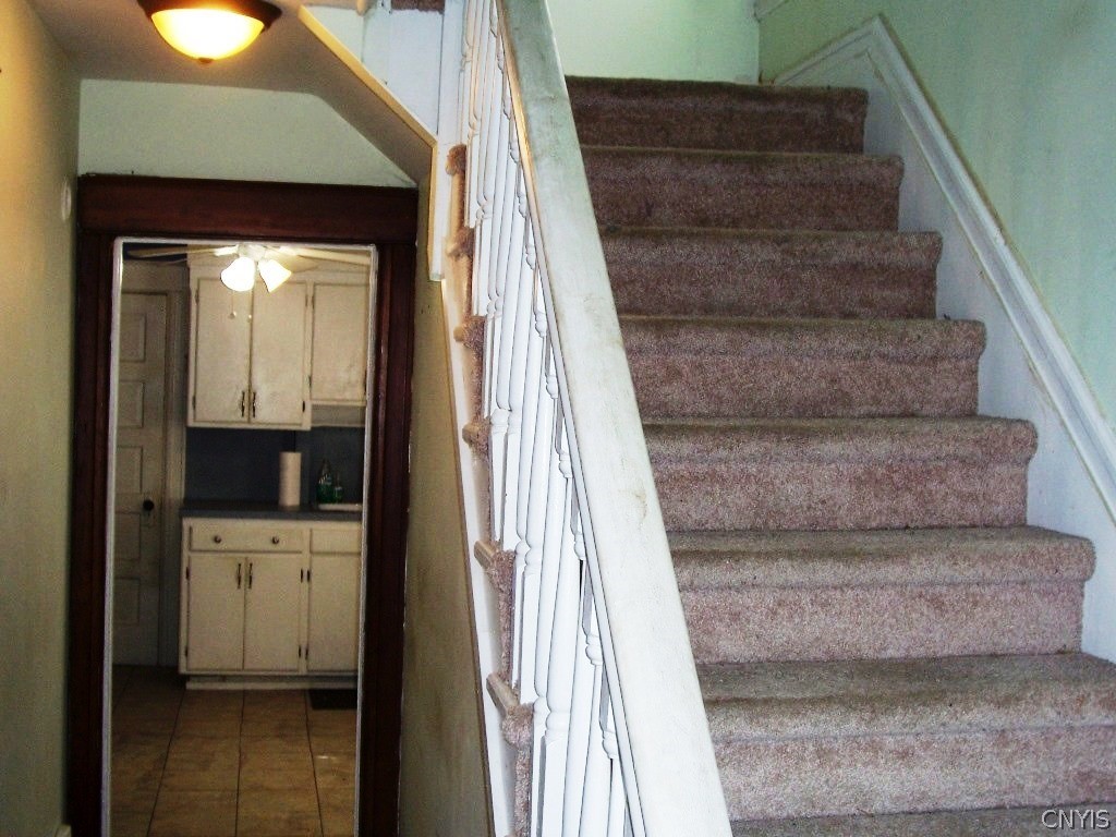 706 1/2 North George Street Rome, NY 13440 - Photo 8 of 22 Entry Foyer To Staircase Upstairs & Kitchen
