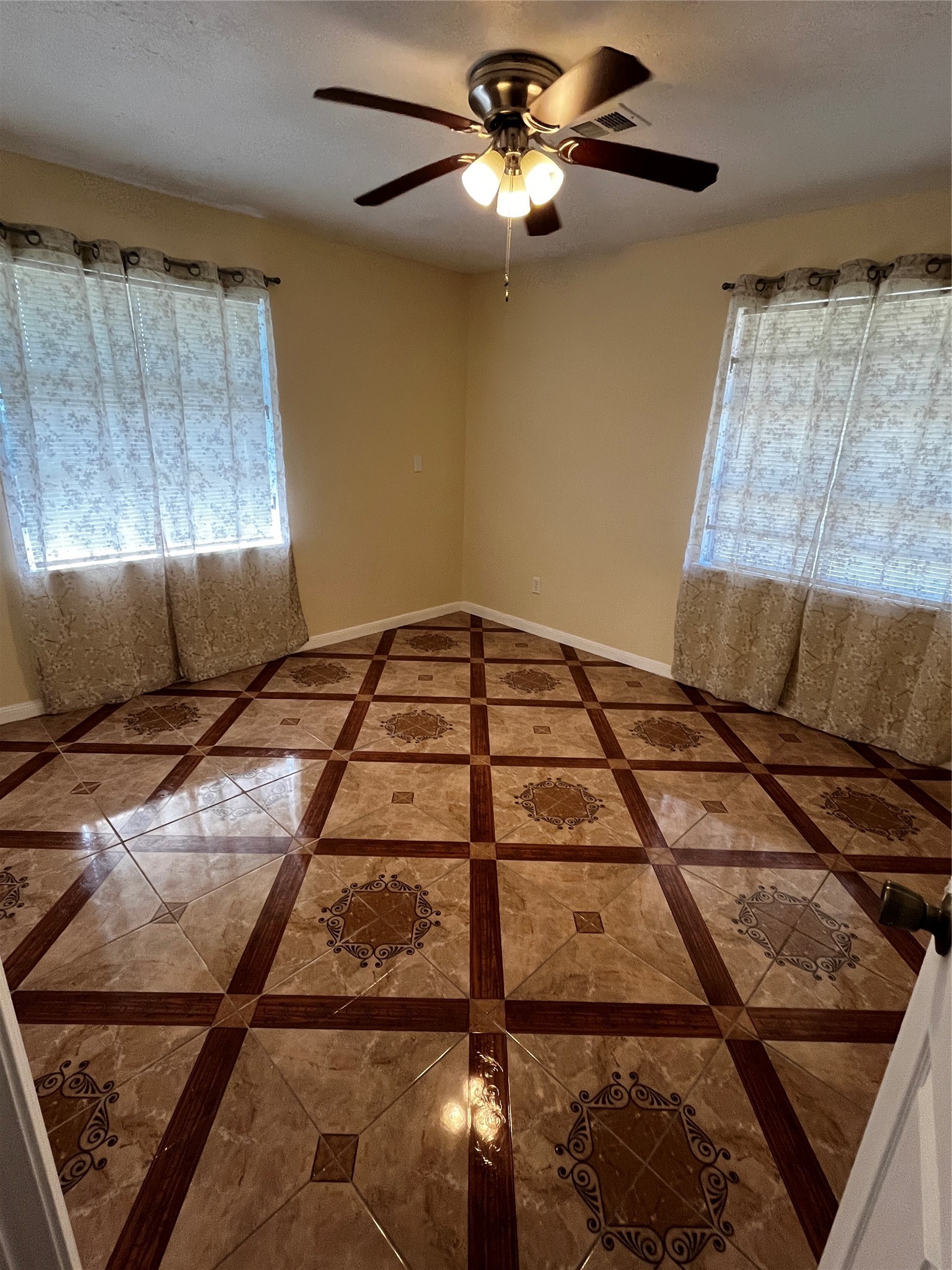 3163 Roe Drive Houston, TX 77087 - Photo 38 of 47 a bedroom with a bed and a chandelier