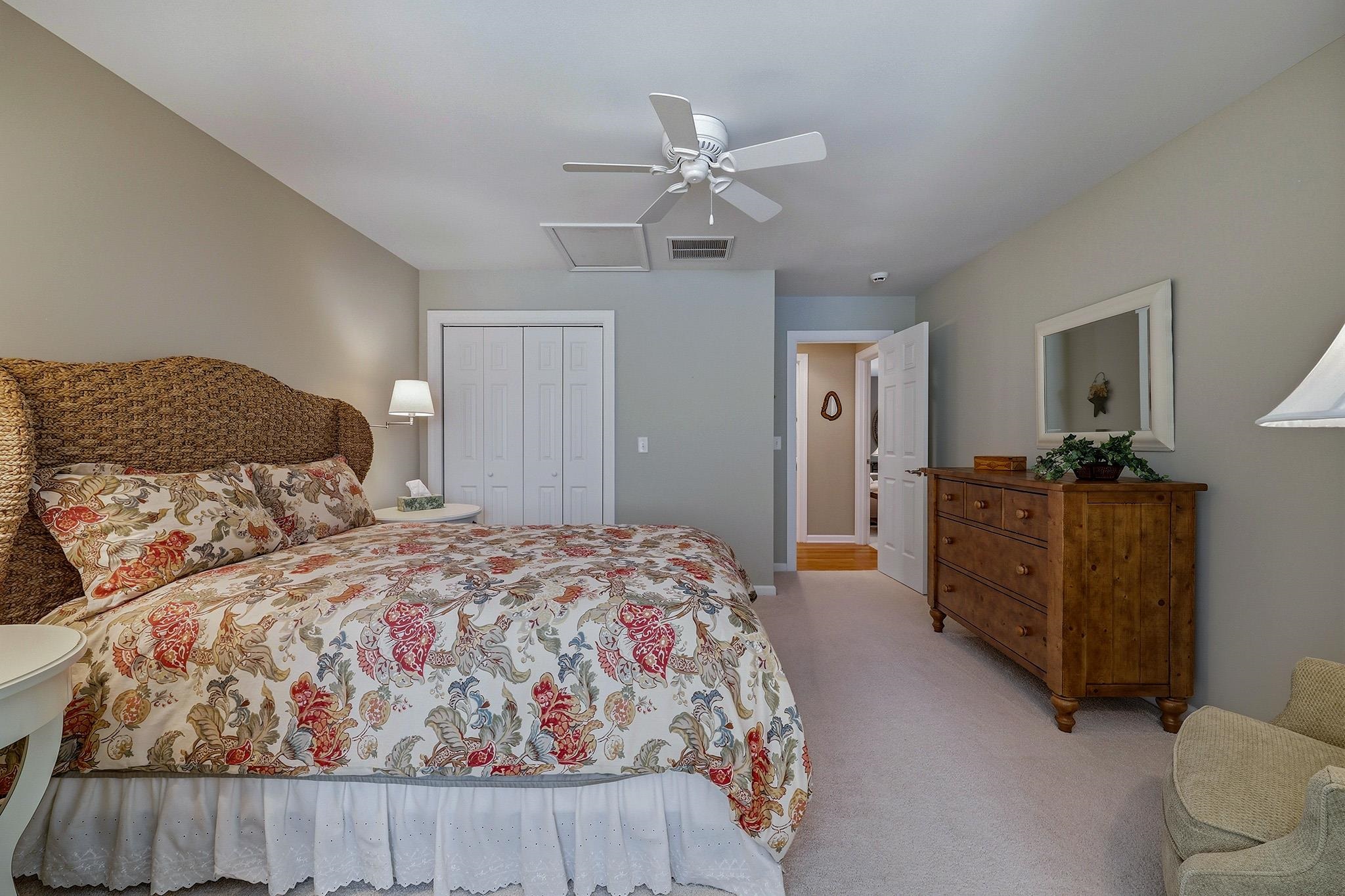 759 Rife's Ford Road Verona, VA 24482 - Photo 39 of 66 a bedroom with a large bed and a chandelier