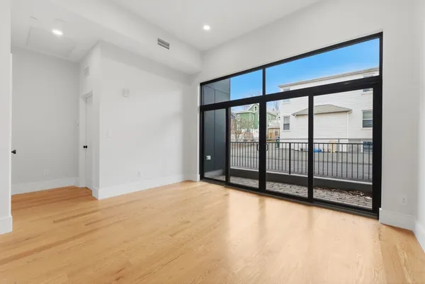 a view of a room with sliding glass door