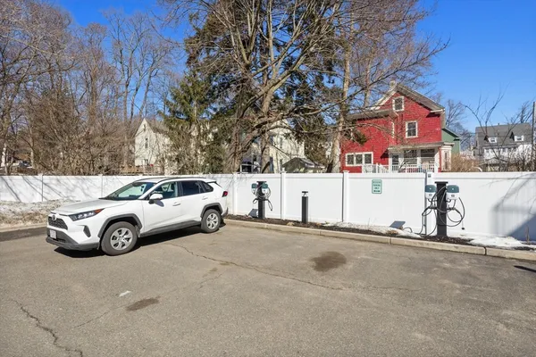 a view of street with parked cars