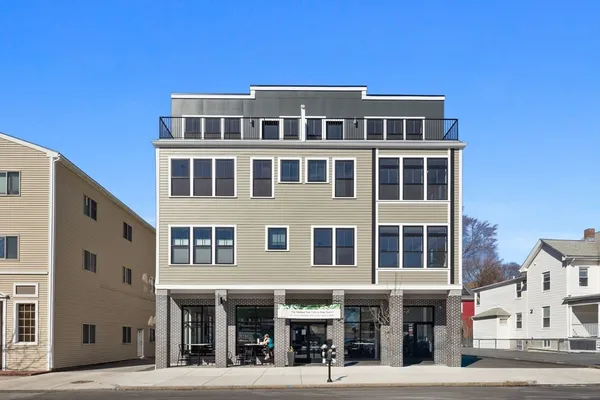 a front view of a building with a street