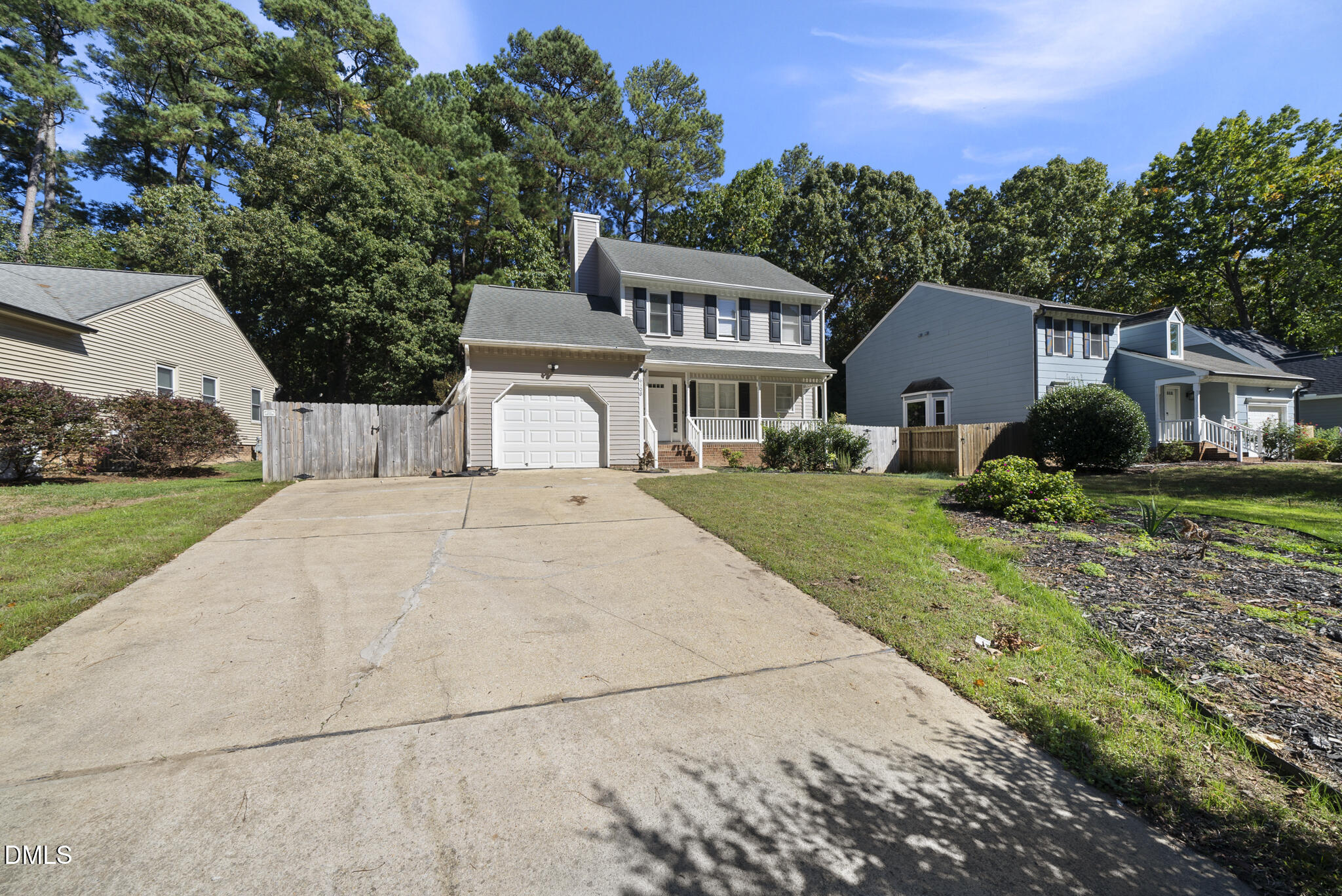 6108 New Market Way Raleigh, NC 27609 - Photo 1 of 31 a front view of a house with a yard