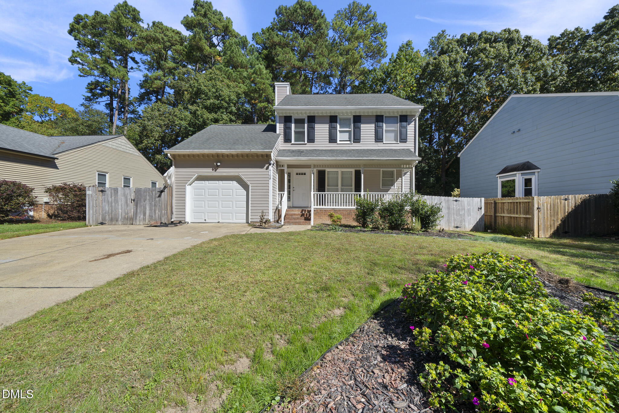 6108 New Market Way Raleigh, NC 27609 - Photo 2 of 31 a front view of a house with garden