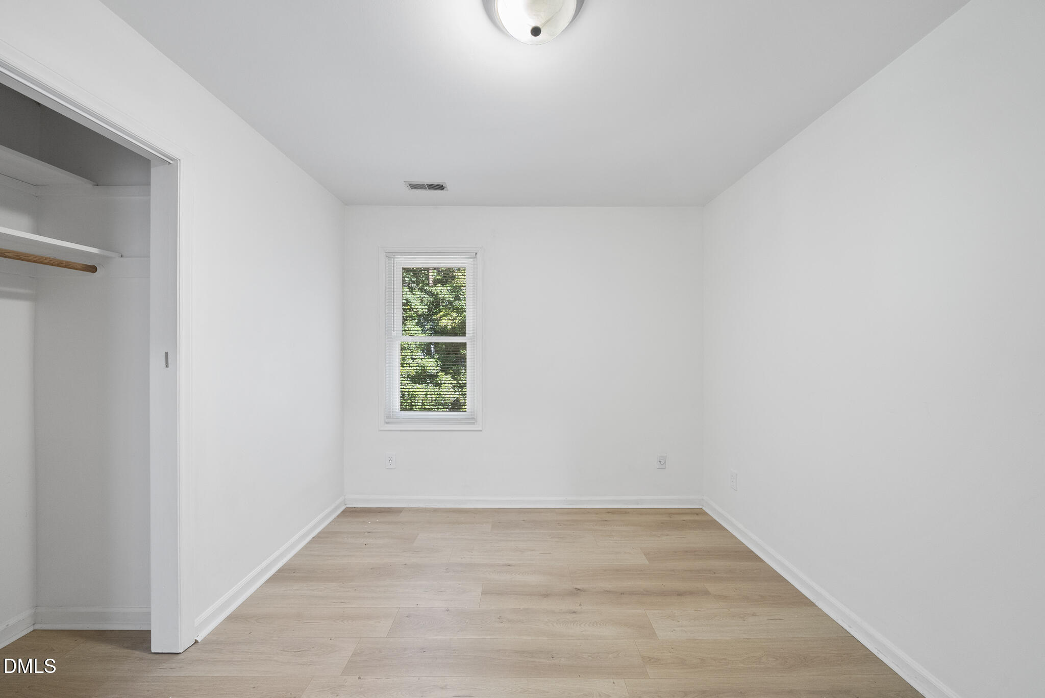 6108 New Market Way Raleigh, NC 27609 - Photo 28 of 31 a view of an empty room with a window