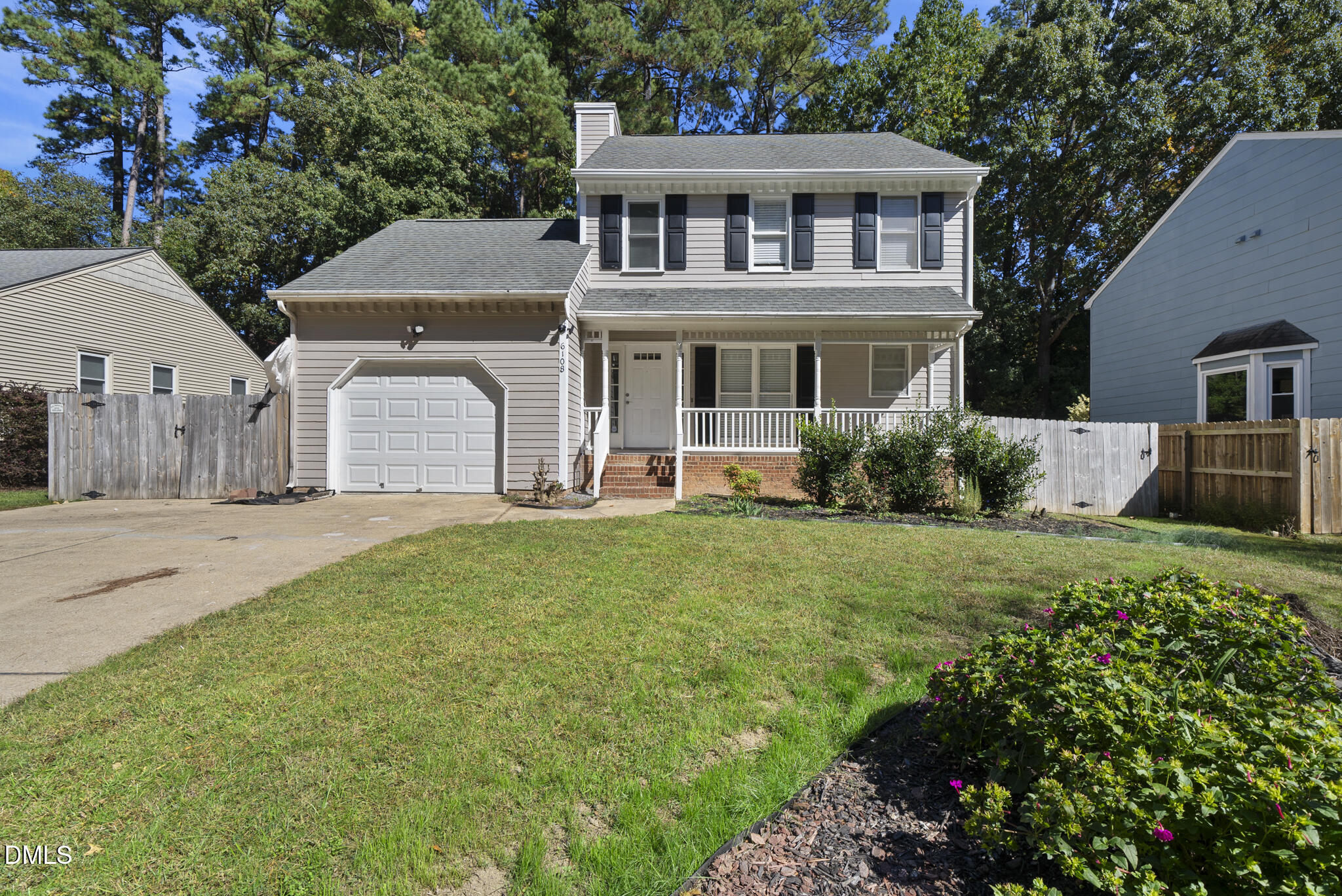 6108 New Market Way Raleigh, NC 27609 - Photo 3 of 31 a front view of a house with a garden and plants