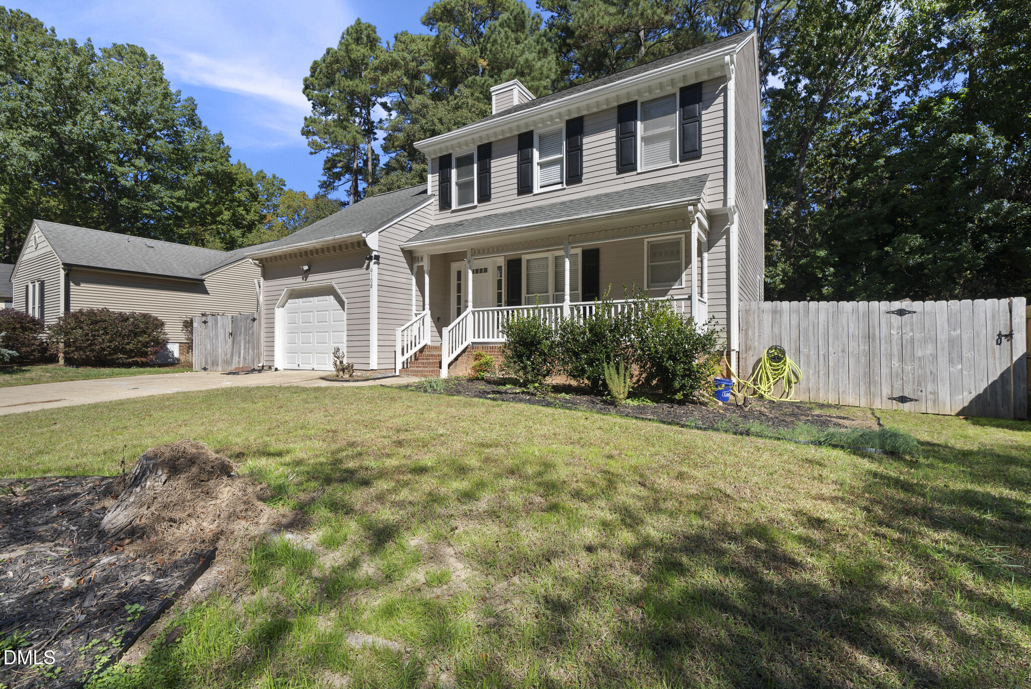 6108 New Market Way Raleigh, NC 27609 - Photo 4 of 31 a front view of a house with garden