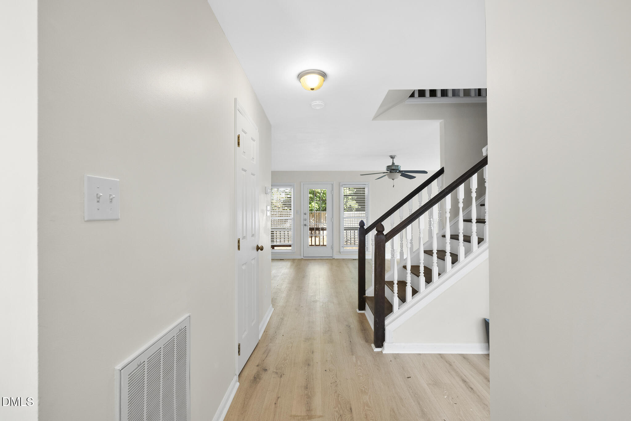 6108 New Market Way Raleigh, NC 27609 - Photo 5 of 31 a view of entryway and hall with wooden floor