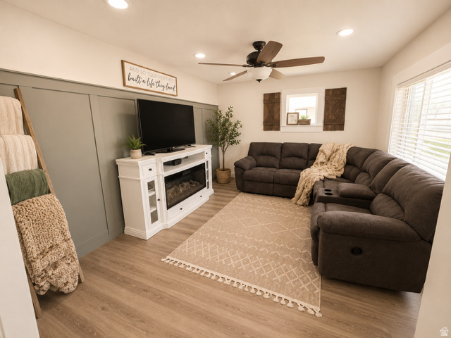 303 North Main Street Grace, ID 83241 - Photo 7 of 22 Living area featuring wood-finish flooring and a white electric fireplace media console