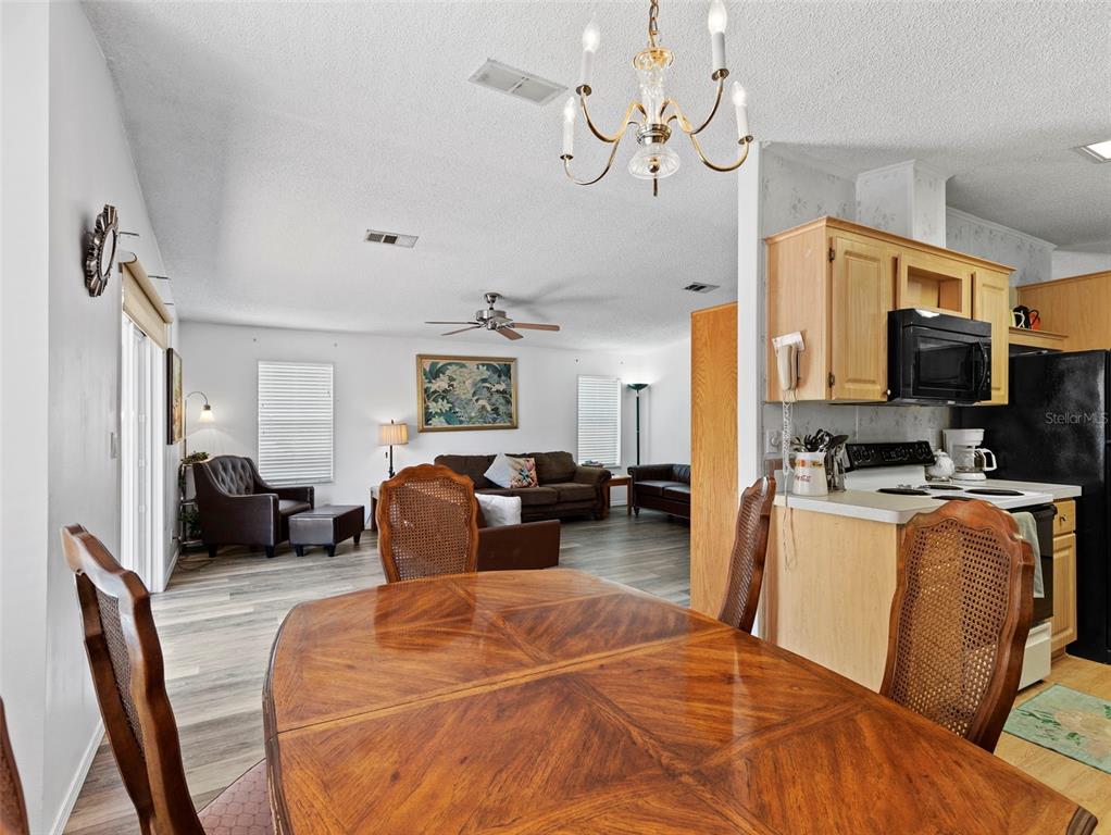 6297 Fine Street Weeki Wachee, FL 34607 - Photo 12 of 52 a bedroom with furniture and a flat screen tv