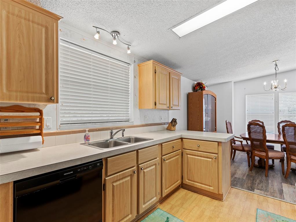 6297 Fine Street Weeki Wachee, FL 34607 - Photo 13 of 52 a kitchen with a sink cabinets and appliances