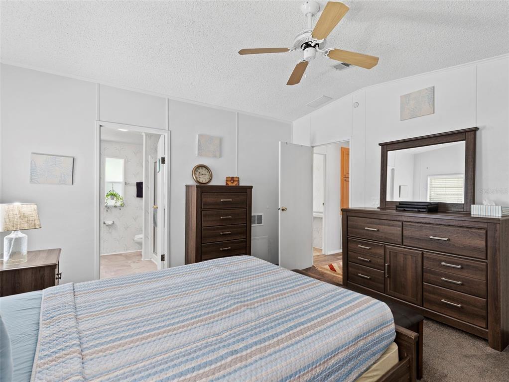 6297 Fine Street Weeki Wachee, FL 34607 - Photo 18 of 52 a bedroom with a bed and a dresser