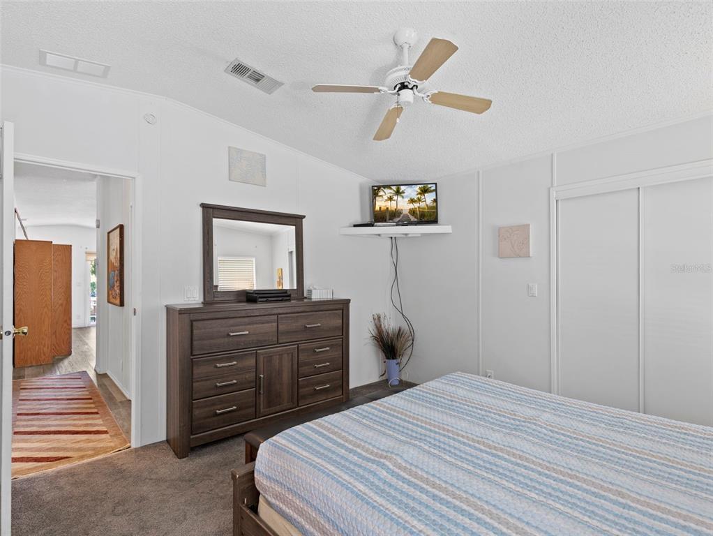 6297 Fine Street Weeki Wachee, FL 34607 - Photo 20 of 52 a bedroom with a bed and a television
