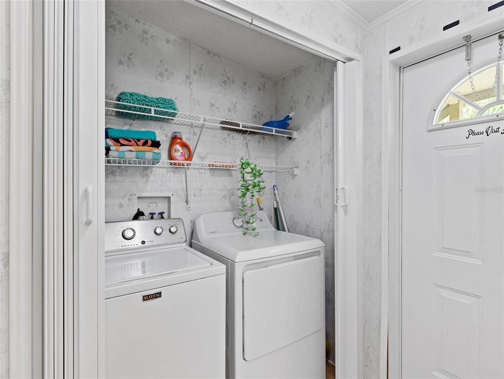 6297 Fine Street Weeki Wachee, FL 34607 - Photo 27 of 52 a utility room with dryer and washer