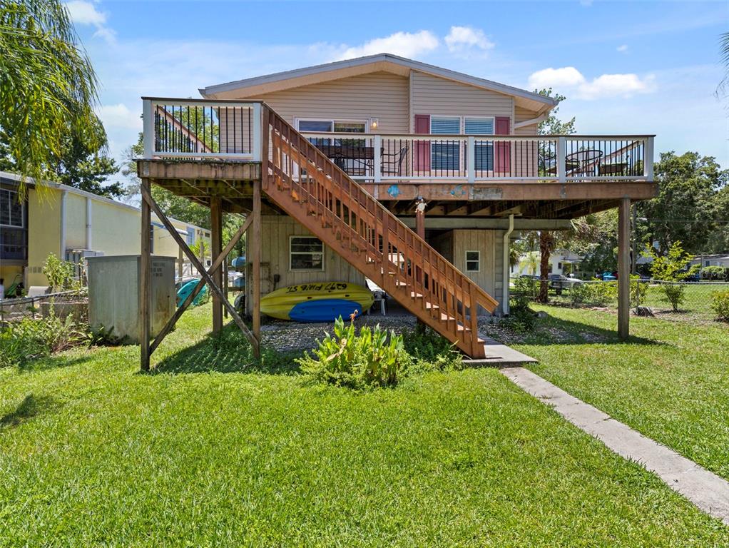 6297 Fine Street Weeki Wachee, FL 34607 - Photo 36 of 52 a front view of a house with garden
