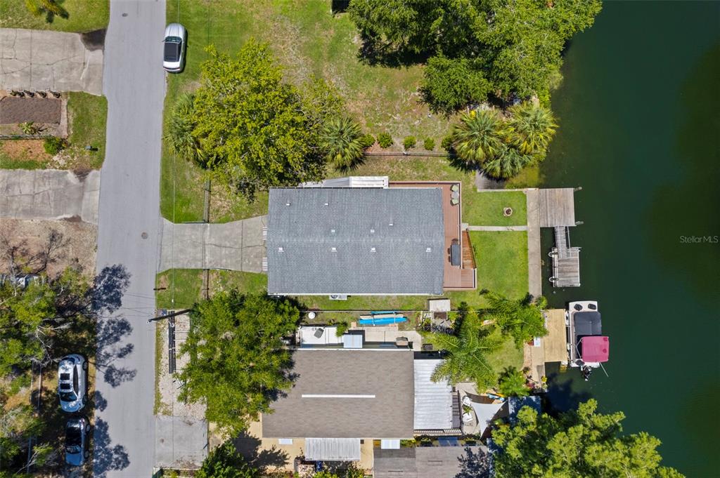 6297 Fine Street Weeki Wachee, FL 34607 - Photo 45 of 52 an aerial view of a house with a yard and a large tree