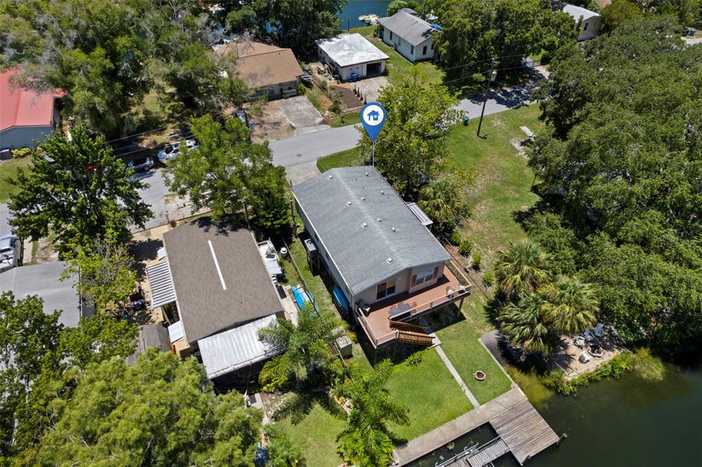 6297 Fine Street Weeki Wachee, FL 34607 - Photo 46 of 52 an aerial view of a house with swimming pool and outdoor seating