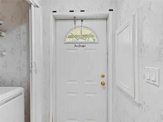 a bathroom with a granite countertop shower and a sink