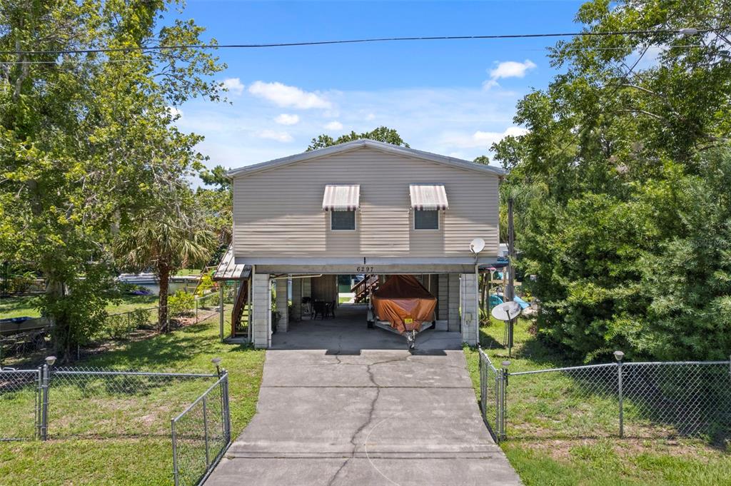 6297 Fine Street Weeki Wachee, FL 34607 - Photo 52 of 52 a front view of a house with a yard