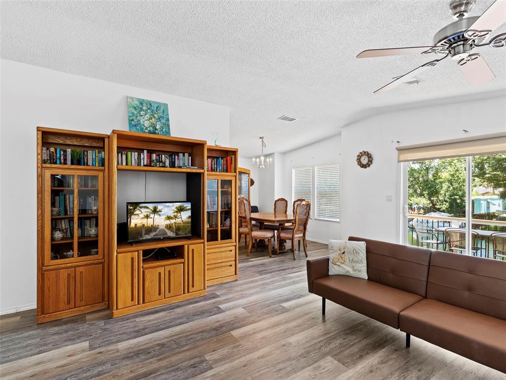 6297 Fine Street Weeki Wachee, FL 34607 - Photo 7 of 52 a living room with furniture and a fireplace