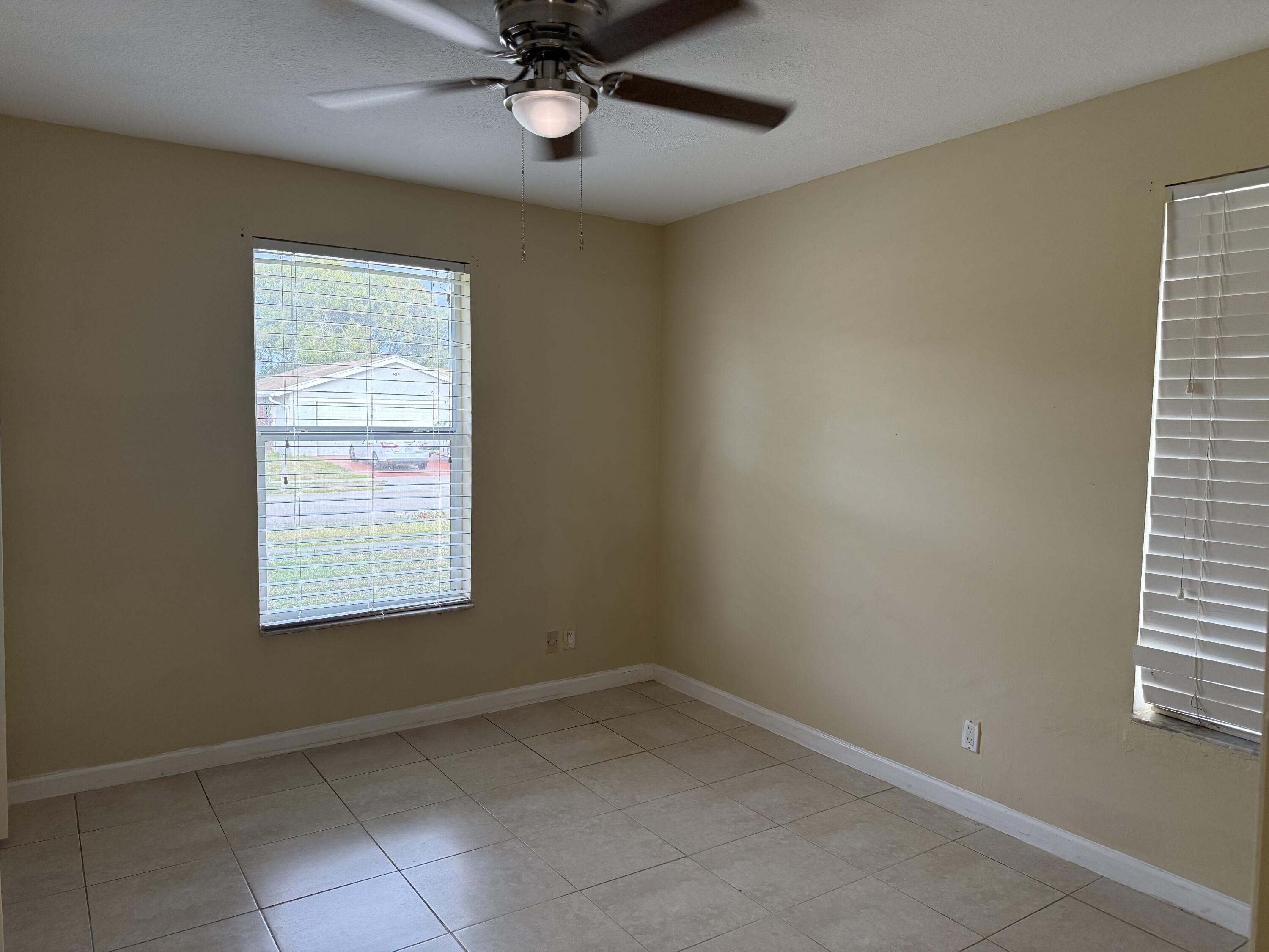 4941 Marbella Road North West Palm Beach, FL 33417 - Photo 6 of 12 an empty room with a window