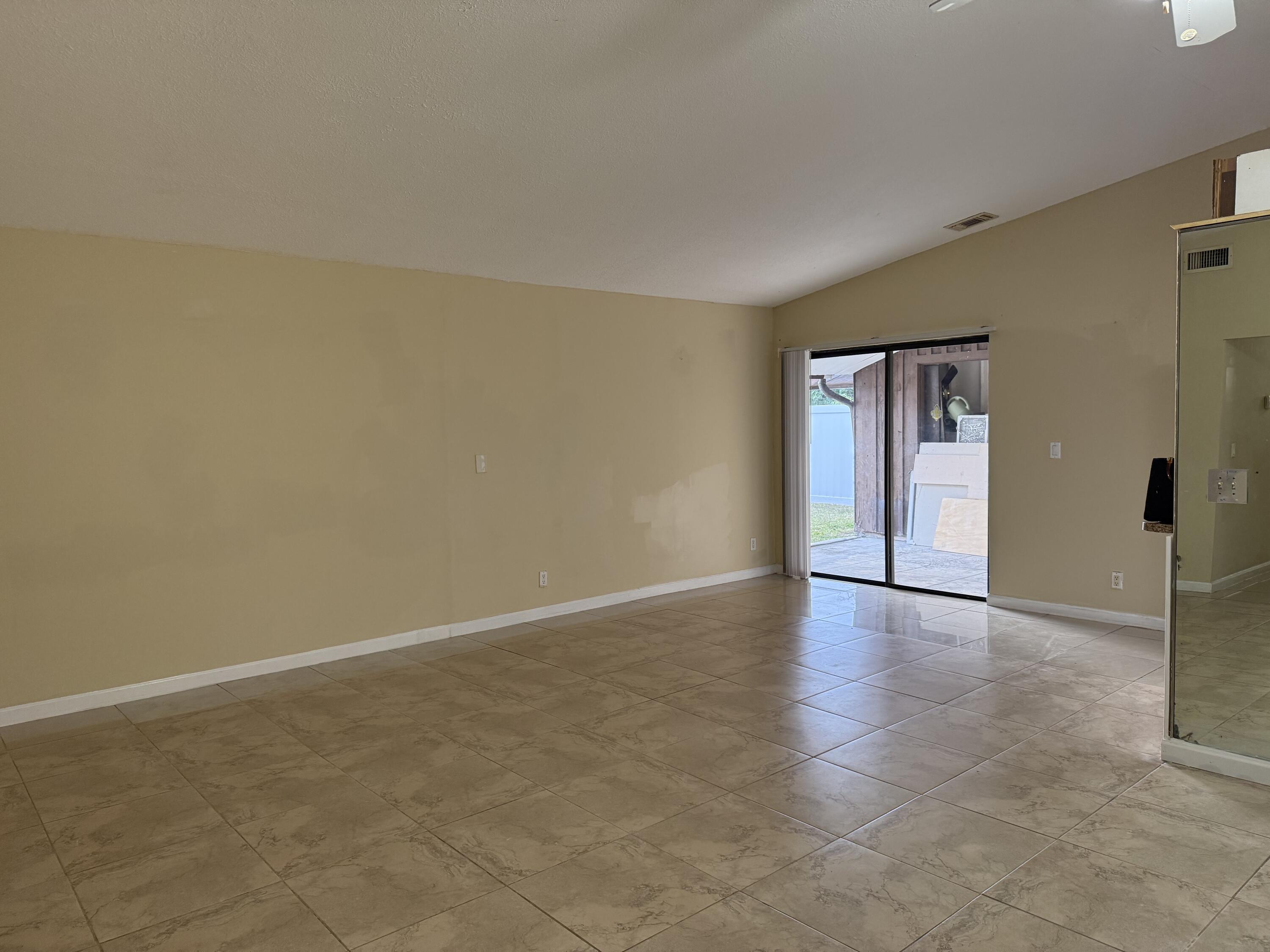 4941 Marbella Road North West Palm Beach, FL 33417 - Photo 10 of 12 an empty room with windows and closet