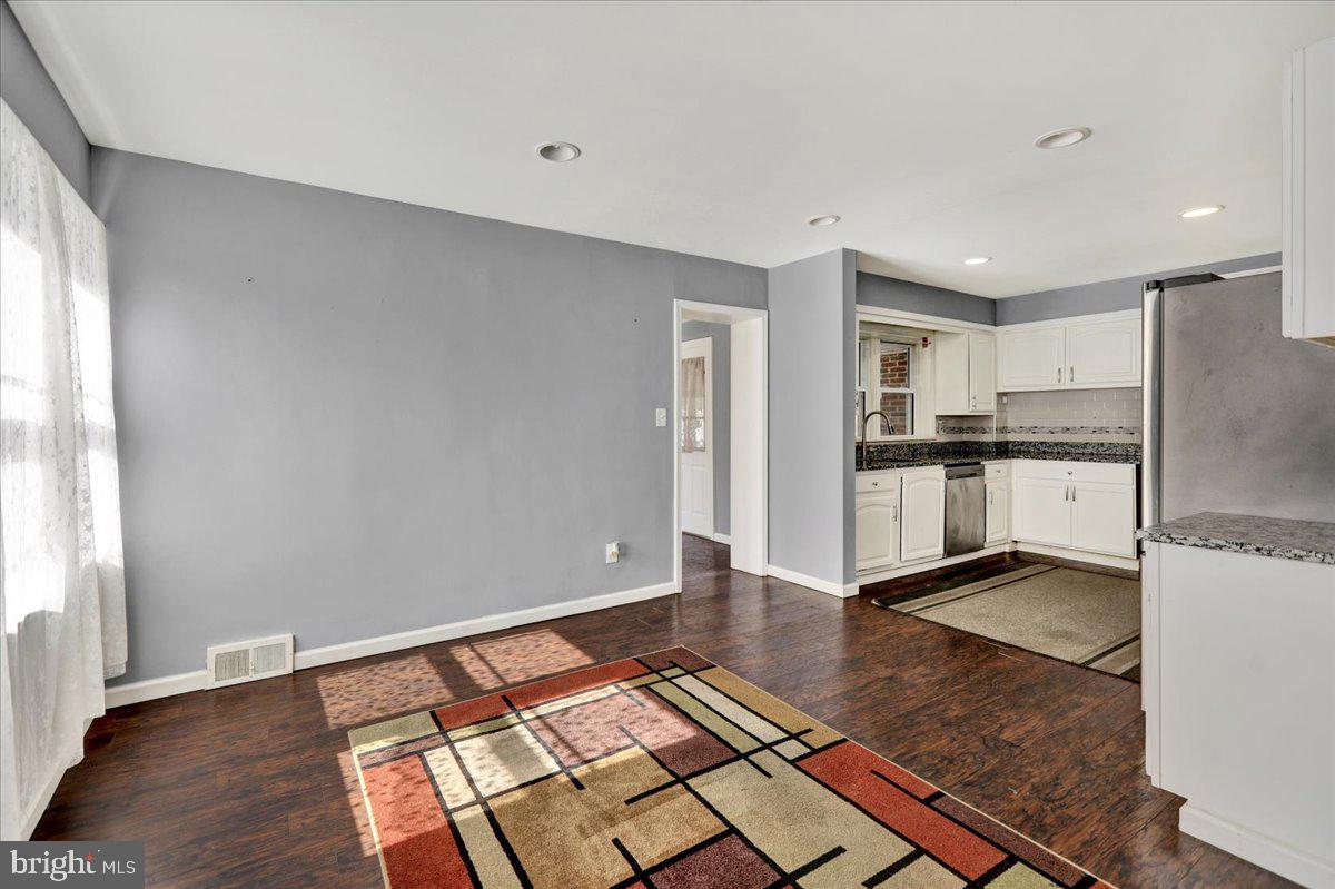 212 Mayer Street Reading, PA 19606 - Photo 11 of 37 a kitchen with stainless steel appliances granite countertop a refrigerator and a sink