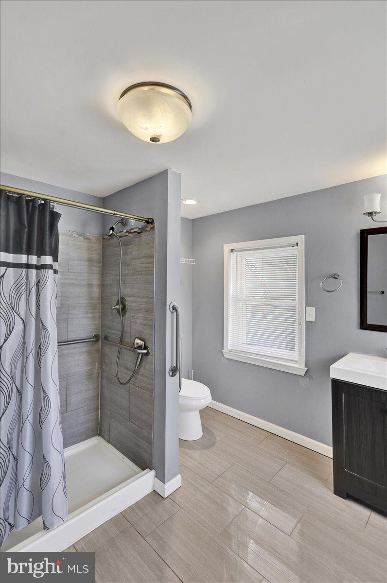 212 Mayer Street Reading, PA 19606 - Photo 26 of 37 a bathroom with a shower toilet and sink