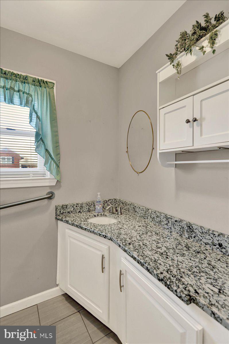 212 Mayer Street Reading, PA 19606 - Photo 8 of 37 a bathroom with a sink and a mirror